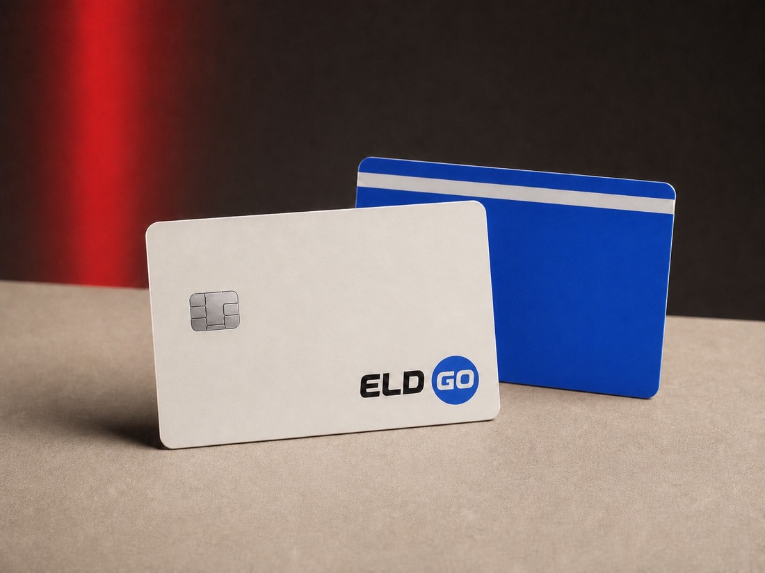 Two ELD Go fleet fuel cards photographed on a beige studio surface